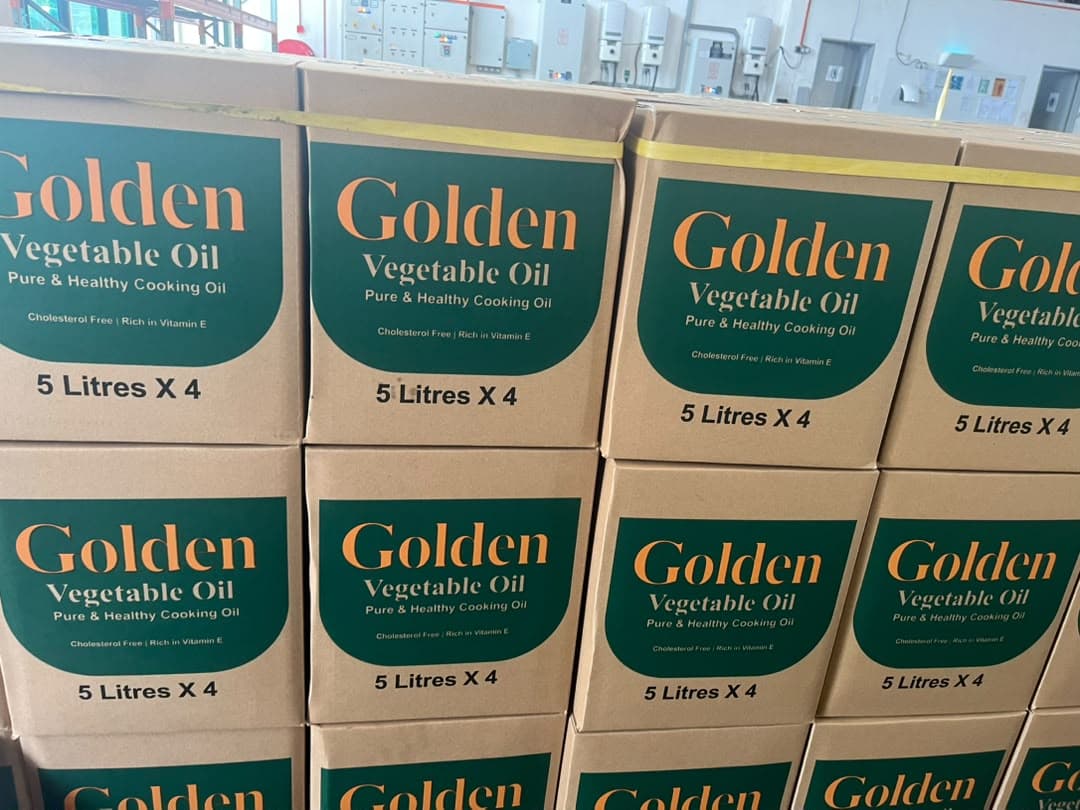 Stacked cartons of Golden Vegetable Oil, 5 litres × 4